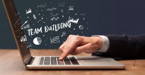 virtual team building image of laptop and hand